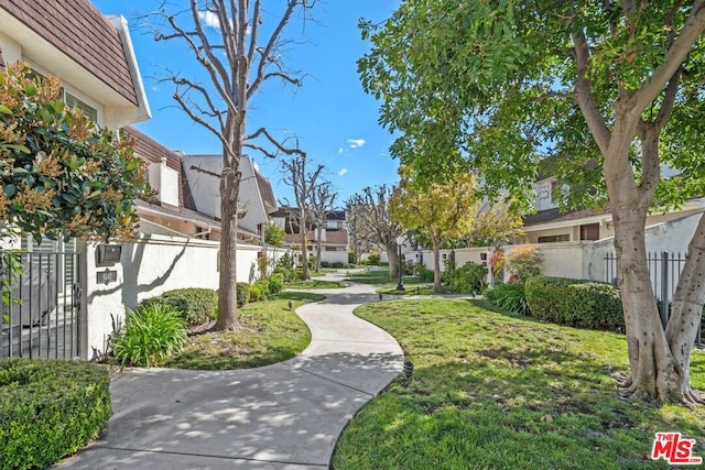 view of community featuring a yard