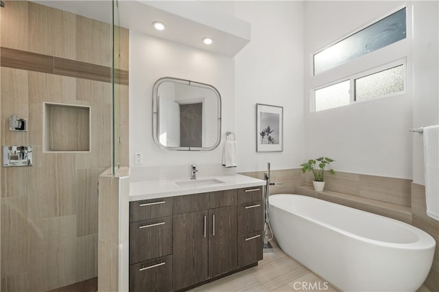 bathroom featuring vanity, separate shower and tub, and tile patterned flooring