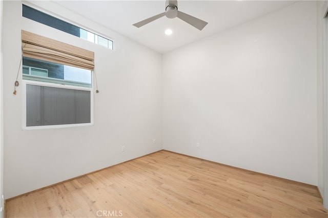 spare room featuring ceiling fan and hardwood / wood-style floors