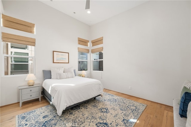 bedroom featuring light hardwood / wood-style floors and ceiling fan