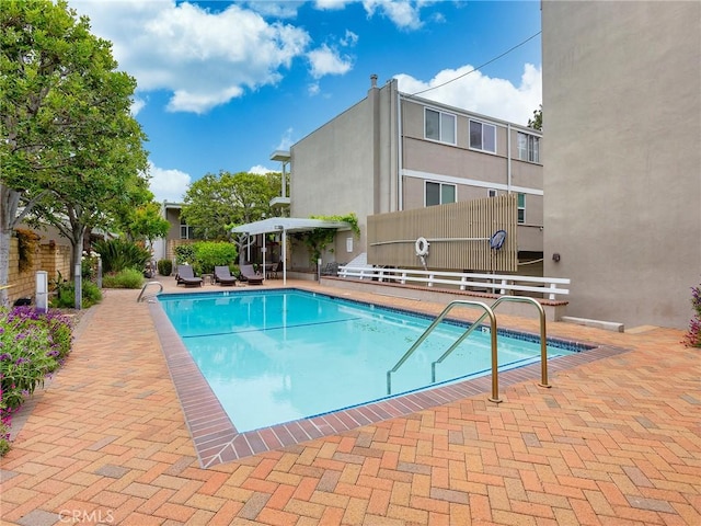 view of swimming pool featuring a patio