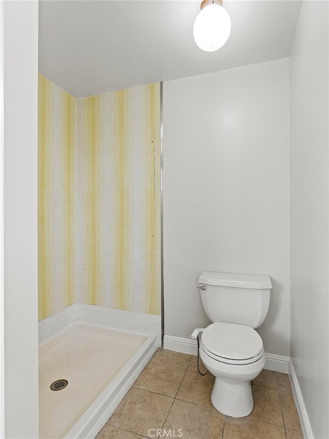 bathroom with tile patterned floors and toilet