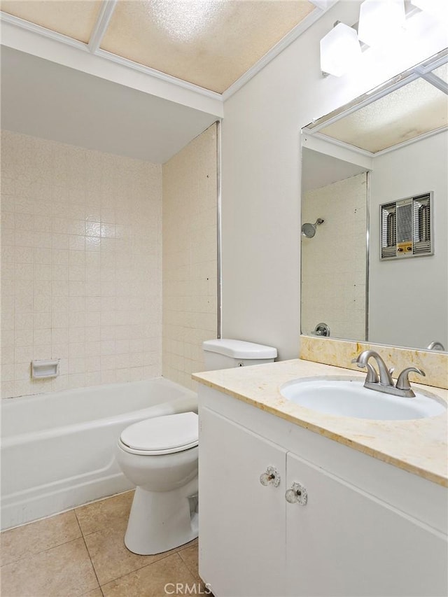 full bathroom with vanity, tile patterned flooring, tiled shower / bath combo, toilet, and a textured ceiling