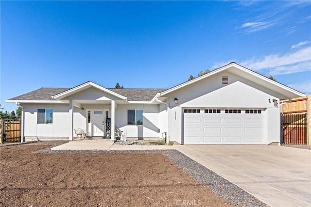 ranch-style home featuring a garage