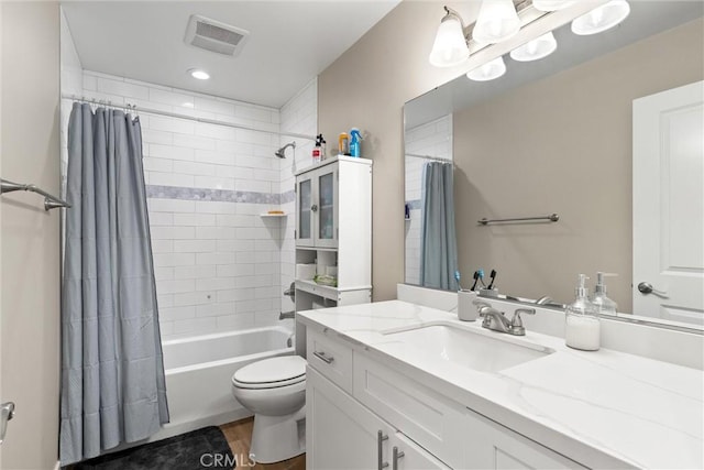 full bathroom with shower / bath combo, toilet, and vanity