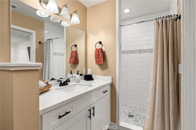 bathroom featuring a shower with curtain and vanity