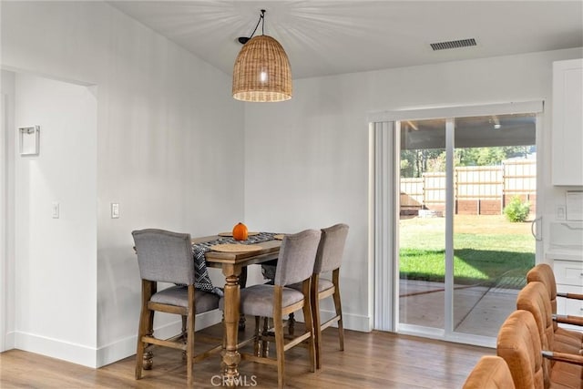 dining space featuring hardwood / wood-style flooring