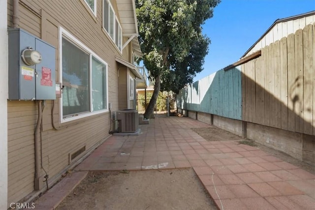 view of home's exterior featuring central AC unit and a patio