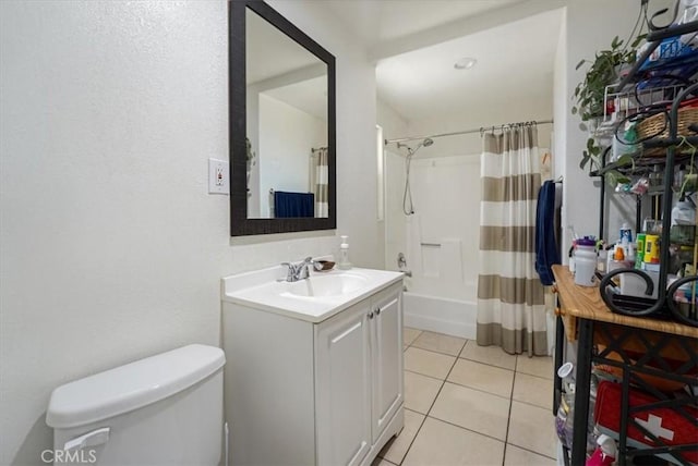 full bathroom featuring shower / tub combo, vanity, tile patterned floors, and toilet