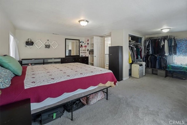 carpeted bedroom featuring a closet