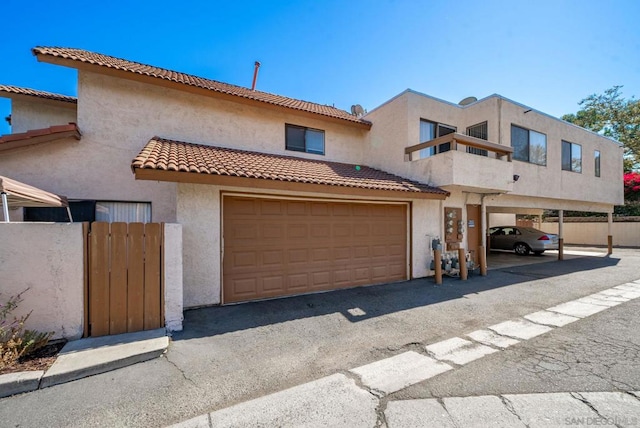 view of front of house with a carport and a garage