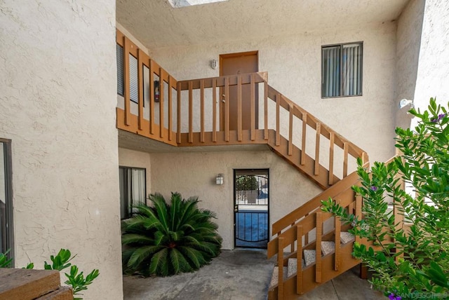 entrance to property featuring a balcony