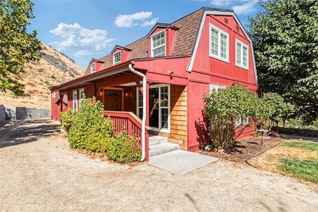 townhome / multi-family property featuring a porch