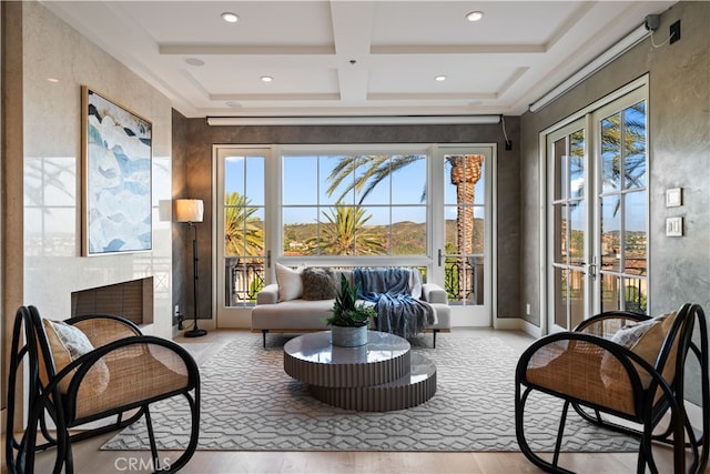 sunroom / solarium featuring beamed ceiling and coffered ceiling