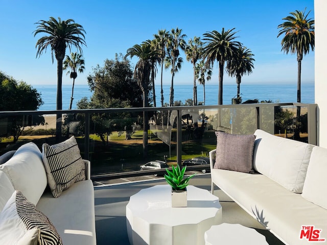 balcony featuring a water view