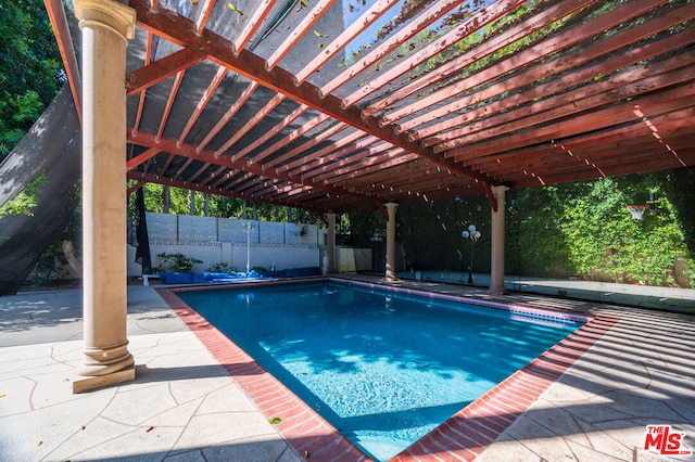 view of swimming pool featuring a patio