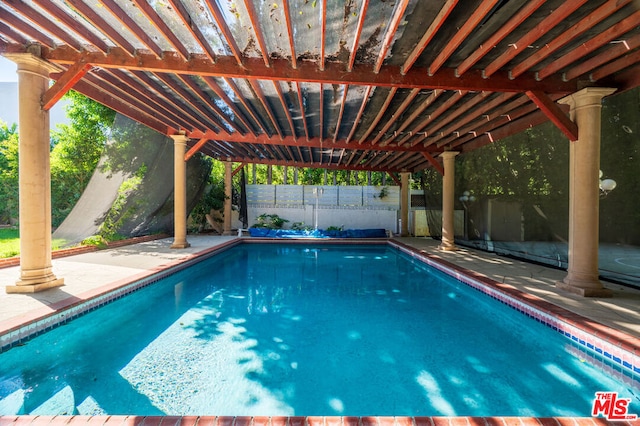 view of pool featuring a pergola and a patio area