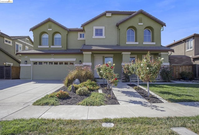 view of front of house with a front lawn and a garage