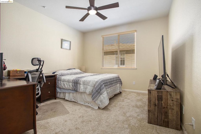 bedroom featuring ceiling fan and light carpet