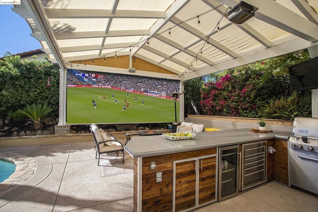 view of patio / terrace with area for grilling and wine cooler