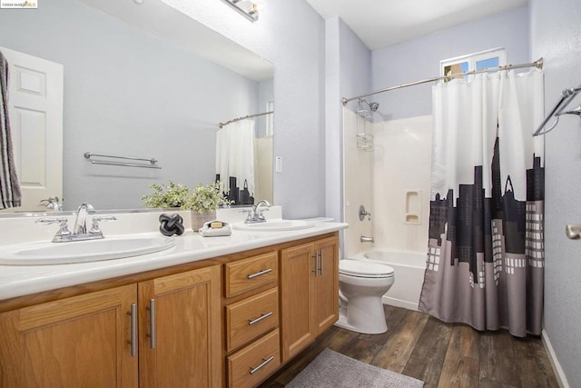 full bathroom featuring shower / bathtub combination with curtain, hardwood / wood-style floors, vanity, and toilet