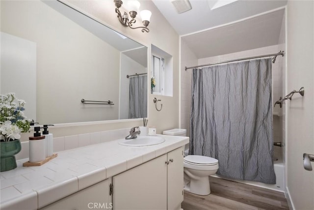 full bathroom with vanity, toilet, shower / bathtub combination with curtain, and wood-type flooring