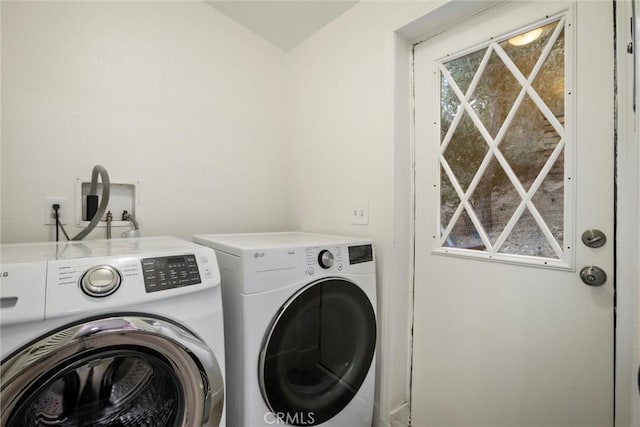 laundry room featuring washing machine and clothes dryer