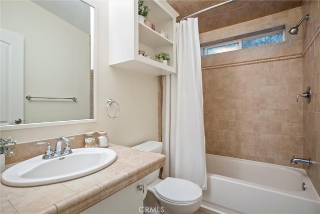 full bathroom featuring sink, toilet, and shower / bath combination with curtain