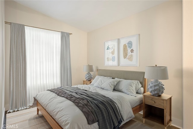 bedroom featuring lofted ceiling