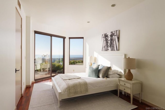 bedroom featuring hardwood / wood-style floors and access to exterior