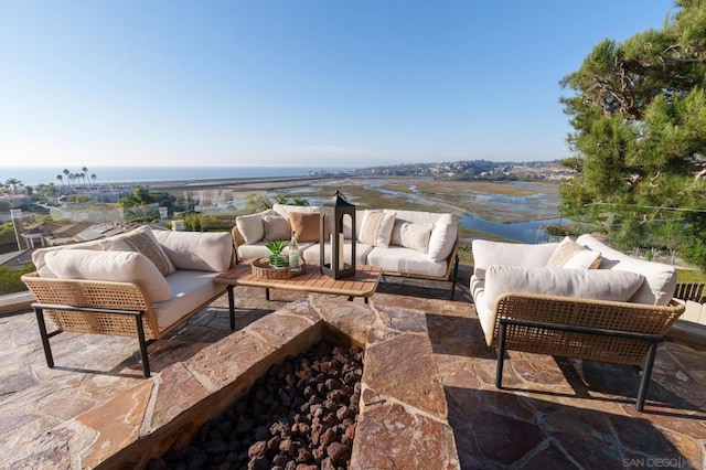 view of patio / terrace featuring a water view and an outdoor hangout area