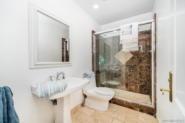 bathroom with walk in shower and toilet