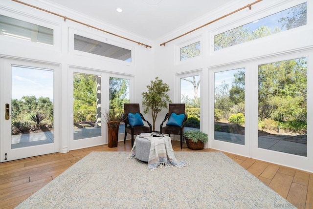 sunroom / solarium featuring french doors