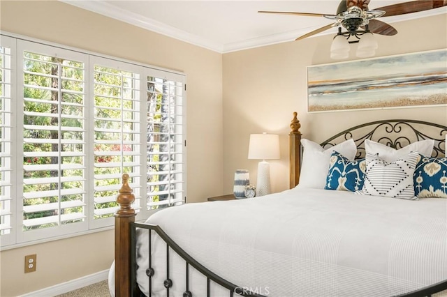 bedroom with crown molding, baseboards, and ceiling fan