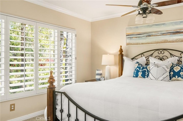 bedroom featuring crown molding, carpet floors, baseboards, and multiple windows