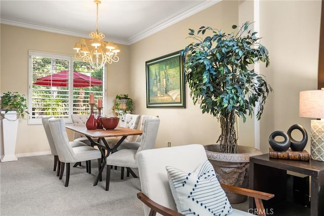 dining space with baseboards, carpet floors, an inviting chandelier, and ornamental molding