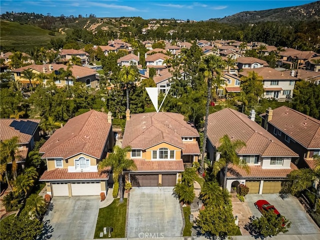 birds eye view of property with a residential view