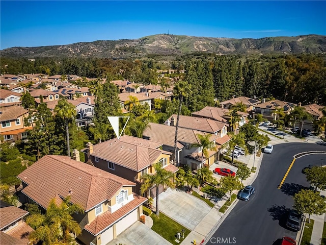 aerial view with a mountain view and a residential view