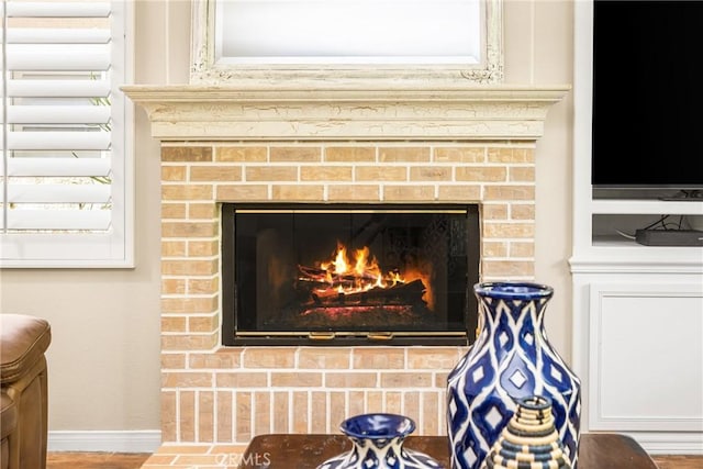 room details with a fireplace and baseboards