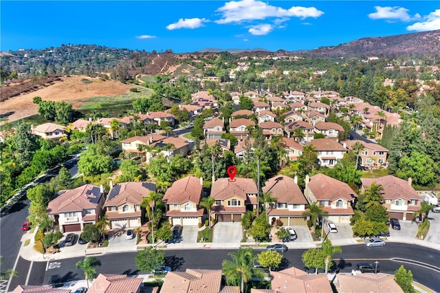 birds eye view of property with a residential view and a mountain view