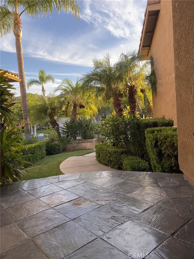 view of home's community with a patio area