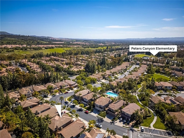aerial view featuring a residential view and a mountain view