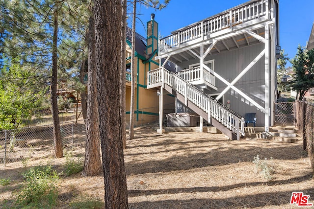 back of property with a wooden deck