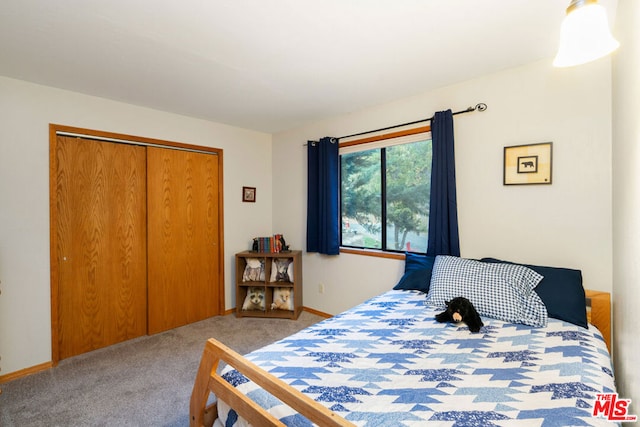 carpeted bedroom with a closet