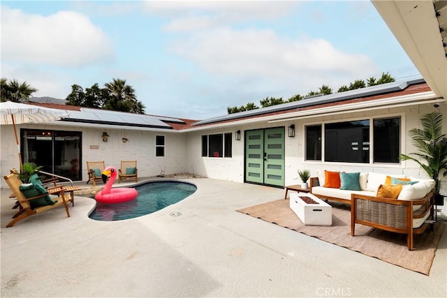 view of pool with a patio area and an outdoor hangout area