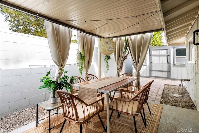 view of patio with a storage unit