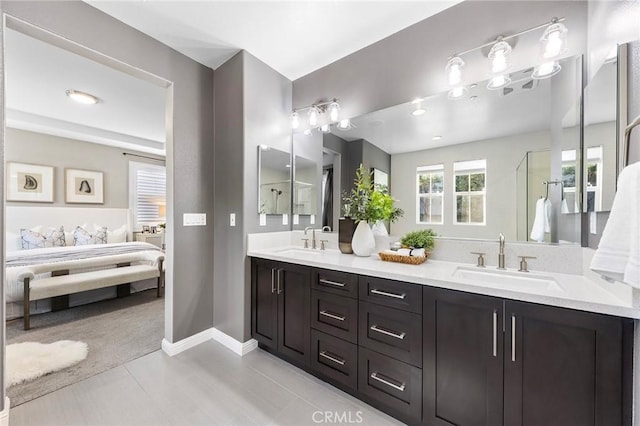 bathroom featuring tile patterned flooring and vanity