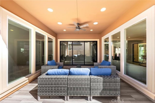 view of patio / terrace featuring an outdoor hangout area, a baseboard radiator, and ceiling fan