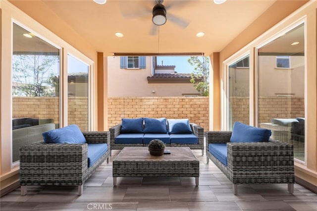 view of patio / terrace featuring an outdoor living space and ceiling fan