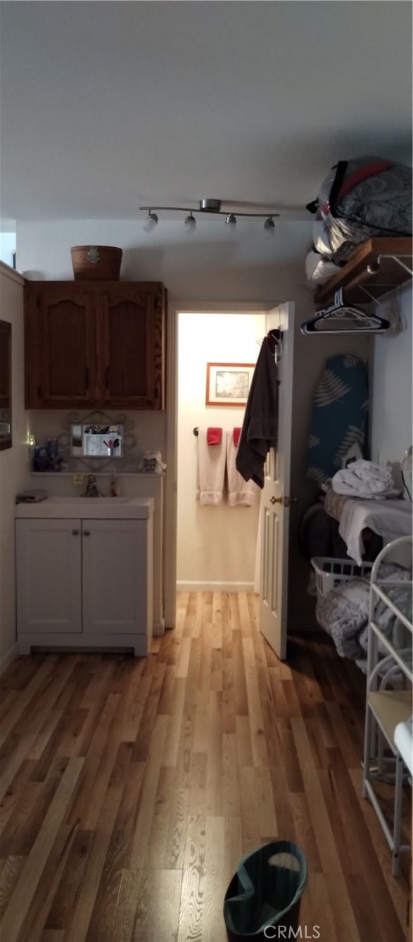 kitchen featuring light hardwood / wood-style floors and rail lighting